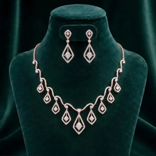 Modern angular drop necklace and earring set featuring sharp geometric diamond accents on a luxury velvet display.