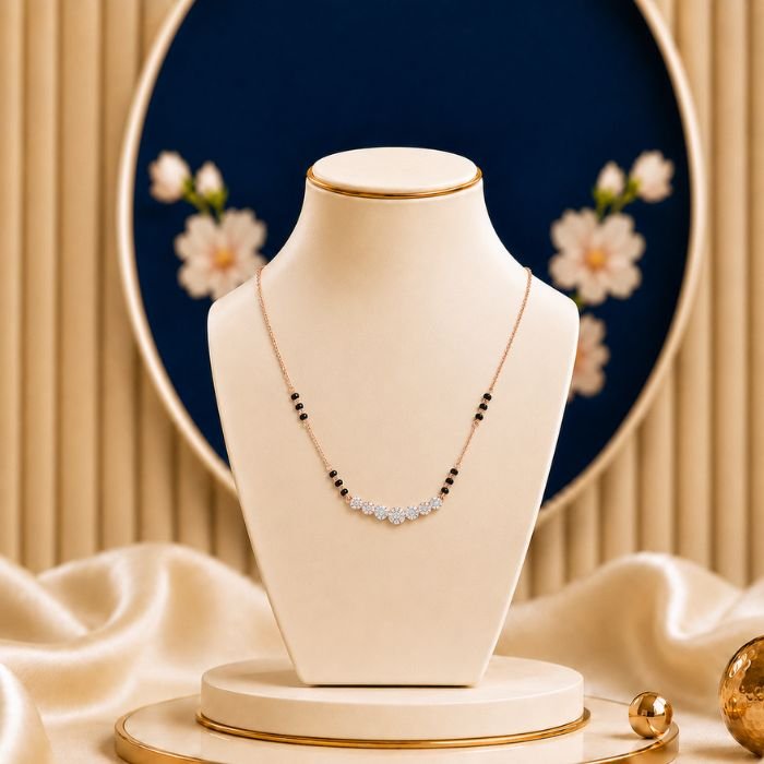 Blossom Smile Lab Grown Diamond Mangalsutra Blossom Smile Lab Grown Diamond Mangalsutra featuring delicate blossom-inspired motifs in a graceful smile-shaped design adorned with sparkling lab-grown diamonds and elegant black bead chain detailing.