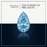Premium macro view of a loose vibrant blue pear cut lab grown diamond resting on a neutral professional background, showcasing brilliant faceting.