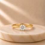 Cushion Cut Solitaire Yellow Gold Ring featuring a sparkling cushion-cut lab-grown diamond set in an elegant polished yellow gold band.