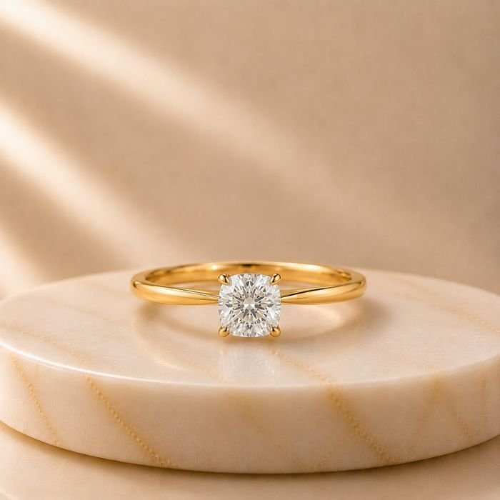 Cushion Cut Solitaire Yellow Gold Ring Cushion Cut Solitaire Yellow Gold Ring featuring a sparkling cushion-cut lab-grown diamond set in an elegant polished yellow gold band.