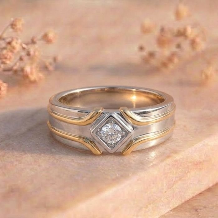 Diamond Bezel Wave Two-Tone Solitaire Ring Diamond Bezel Wave Two-Tone Solitaire Ring featuring a flowing wave-inspired two-tone band with a bezel-set sparkling lab-grown solitaire diamond.