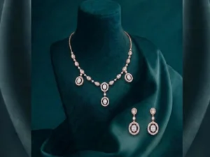 Exquisite CVD diamond drop necklace set with a brilliant pear-cut pendant and matching earrings in hallmarked white gold.