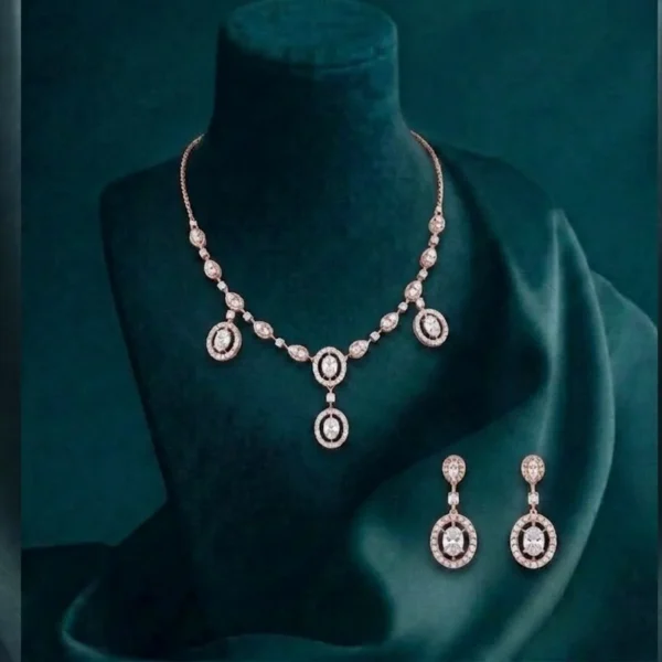 Exquisite CVD diamond drop necklace set with a brilliant pear-cut pendant and matching earrings in hallmarked white gold.