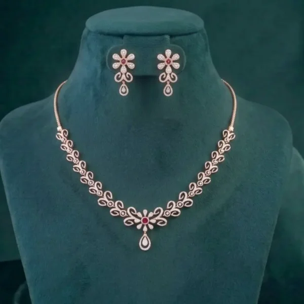 Sophisticated floral diamond necklace and matching earrings featuring intricate petal motifs on a smooth satin display.