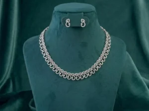 Elegant interlocking diamond necklace set featuring two connected circular hoops pave-set with round brilliant cut CVD diamonds