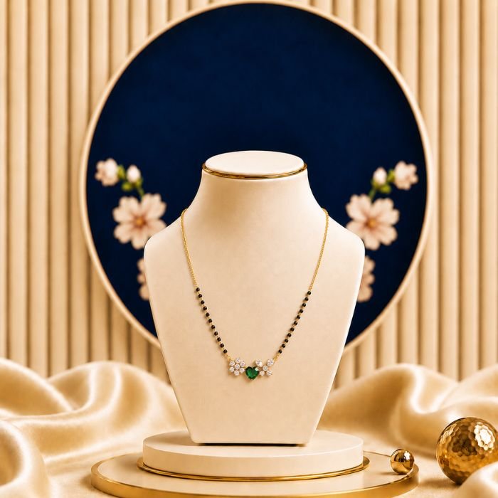 Emerald Bloom Lab Grown Diamond Mangalsutra – Heart Emerald & Diamond Necklace for Women Emerald Bloom Lab Grown Diamond Mangalsutra featuring a heart-shaped emerald-inspired centerpiece adorned with sparkling lab-grown diamonds and elegant black bead chain detailing.