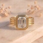 Emerald Cut Bezel Diamond Ring featuring a sleek bezel-set emerald-cut lab-grown diamond with elegant modern detailing.