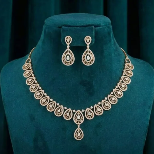 Filigree Teardrop Diamond Set featuring intricate filigree teardrop motifs adorned with sparkling lab-grown diamonds and matching elegant earrings.
