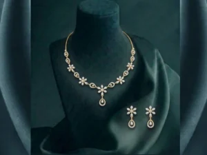 Premium floral teardrop diamond necklace and earring set in gold for luxury wedding jewelry.