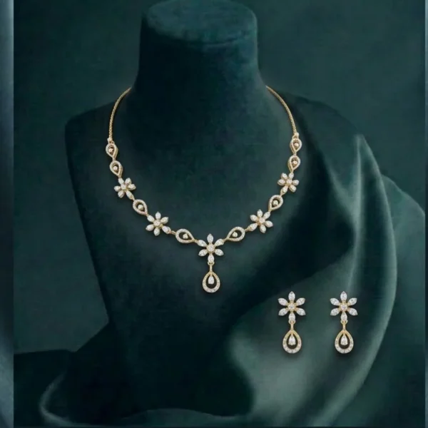 Premium floral teardrop diamond necklace and earring set in gold for luxury wedding jewelry.