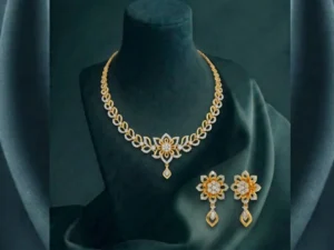 Shimmering diamond necklace and earring set featuring an elegant floral blossom design crafted in polished precious metal.