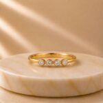 Four Bezel Diamond Gold Ring featuring four sparkling bezel-set lab-grown diamonds crafted in an elegant polished gold band.