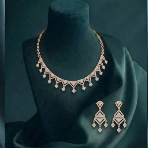 A brilliant diamond necklace and earring set with sharp, V-shaped geometric patterns in a high-polish finish.