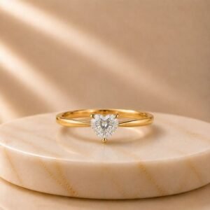 Heart Cut Solitaire Yellow Gold Ring featuring a romantic heart-shaped lab-grown diamond set in an elegant polished yellow gold band.