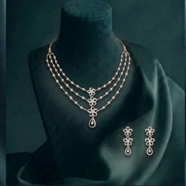 Elegant three-layer lab-grown CVD diamond necklace set with floral blossom motifs in a polished gold finish.