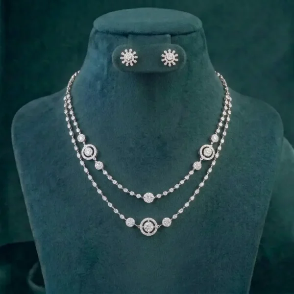 Exquisite layered halo diamond necklace and earring set shimmering on a white marble surface.