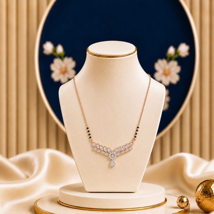 Leafy Drop Diamond Tanmaniya Leafy Drop Diamond Mangalsutra featuring graceful leaf-inspired drop motifs adorned with sparkling lab-grown diamonds and elegant black bead chain detailing.