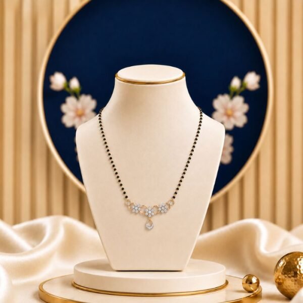 Lotus Loop Lab Grown Diamond Mangalsutra featuring floral vine and teardrop-inspired motifs adorned with sparkling lab-grown diamonds and elegant black bead chain detailing.