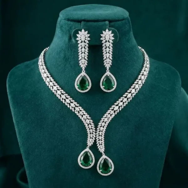Luxury Green Crystal Leaf Necklace Set featuring elegant leaf-inspired patterns adorned with sparkling green crystals and matching earrings.