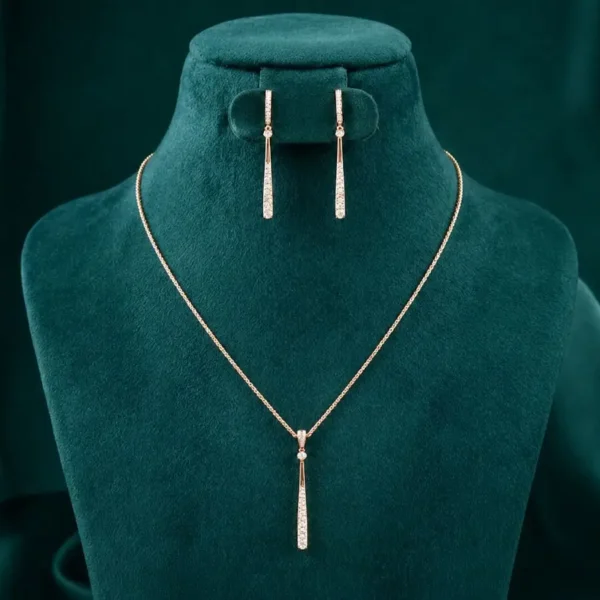 Sleek minimalist bar necklace and matching drop earrings featuring vertical diamond accents on a luxury display.