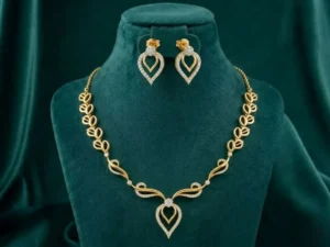 Open Leaf Vine Necklace Set featuring graceful leaf and vine-inspired patterns adorned with sparkling stones and matching elegant earrings.