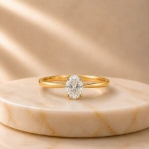 Oval Solitaire Yellow Gold Ring featuring a sparkling oval-cut lab-grown diamond set in an elegant polished yellow gold band.