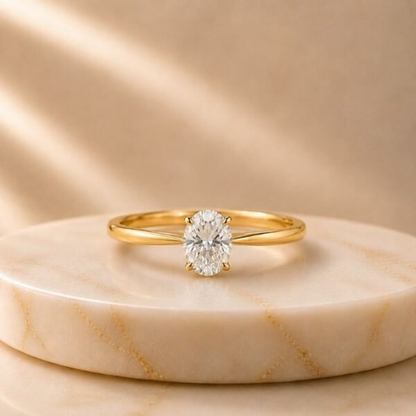 Oval Solitaire Yellow Gold Ring featuring a sparkling oval-cut lab-grown diamond set in an elegant polished yellow gold band.