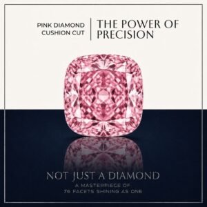 Loose fancy vivid pink cushion cut diamond showing perfect rounded square faceting and brilliant light reflections on a soft white surface.