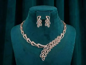 Peacock Plume Diamond Set featuring elegant peacock feather-inspired motifs adorned with sparkling lab-grown diamonds and matching sophisticated earrings.