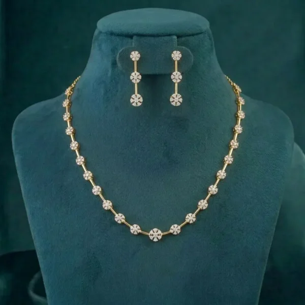 Petal cluster diamond station necklace set in 14k gold featuring round brilliant cut lab grown diamonds in a floral arrangement.