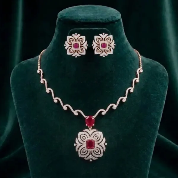 Delicate pink gemstone and diamond necklace set featuring floral blossom motifs on a soft velvet display.