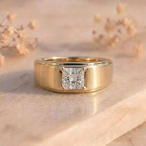 Princess Cut Solitaire Brushed Gold Ring featuring a sparkling princess-cut lab-grown diamond set in a sleek brushed gold band with modern elegance.