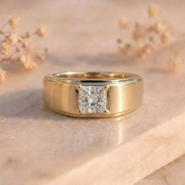 Princess Cut Solitaire Brushed Gold Ring featuring a sparkling princess-cut lab-grown diamond set in a sleek brushed gold band with modern elegance.