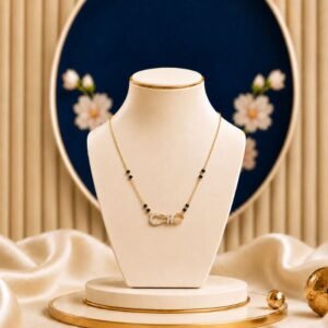 Ribbon Knot Lab Grown Diamond Mangalsutra featuring a romantic pavé ribbon bow motif adorned with sparkling lab-grown diamonds, paired with a refined gold and black bead chain.