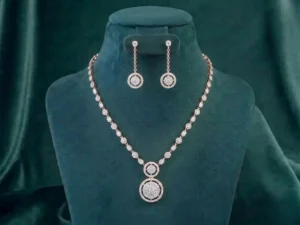 Close-up of a brilliant diamond necklace and matching earrings set against a soft velvet background.