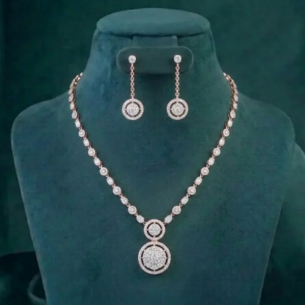 Close-up of a brilliant diamond necklace and matching earrings set against a soft velvet background.