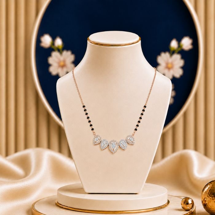 Teardrop Design Diamond Mangalsutra Teardrop Design Diamond Mangalsutra featuring a graceful teardrop-inspired pendant adorned with sparkling lab-grown diamonds and elegant black bead chain detailing.