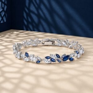 A high-end macro photo of a marquise lab diamond tennis bracelet with white and blue stones