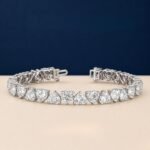 A high-end macro photo of a heart-shape lab diamond tennis bracelet