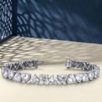 A high-end macro photo of a heart-shape lab diamond tennis bracelet