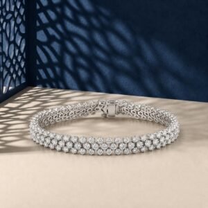 A high-end macro photo of a triple-row round lab diamond tennis bracelet titled Tennis Bracelet