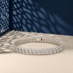 A high-end macro photo of a laurel leaf marquise lab diamond tennis bracelet titled image