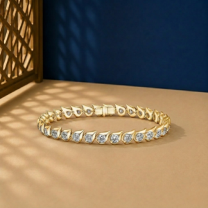 Teardrop bezel-set lab-grown diamond tennis bracelet available in gold and sterling silver 925 finishes.