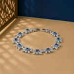 Lab-grown diamond sapphire bracelet in white gold with floral link design.