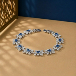 Lab-grown diamond sapphire bracelet in white gold with floral link design.