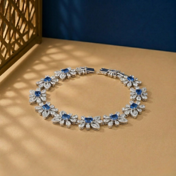 Lab-grown diamond sapphire bracelet in white gold with floral link design.