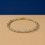 Infinity Link Lab Diamond Bracelet featuring pavé diamonds and high-polish yellow gold interlocking loops.