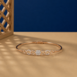 Floral lab diamond bangle bracelet in rose gold finish with circular accents.