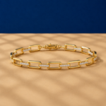 Paperclip lab diamond link bracelet in yellow gold with pavé diamond accents.